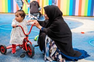 An adult and a child on a bike