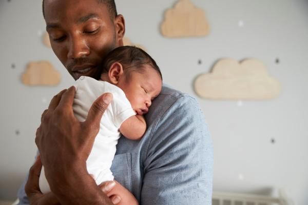 A man holding a baby