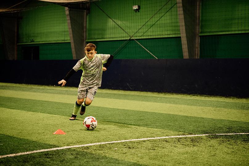 child playing football