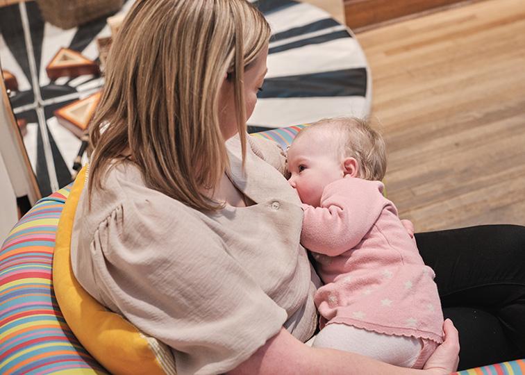 Mum and baby breast feeding