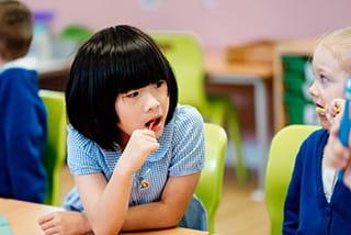 Two children brushing their teeth